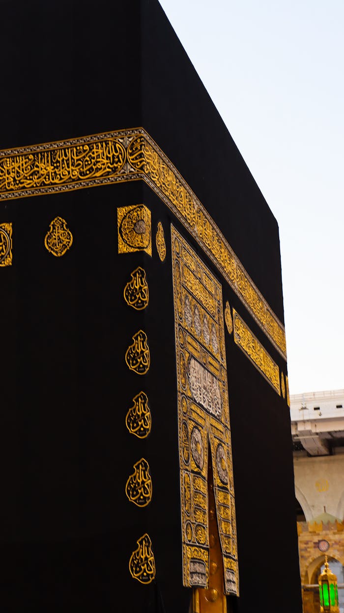 Detailed view of the sacred Kaaba with intricate gold embroidery, Mecca, Saudi Arabia.